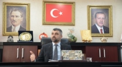 FILE - Faruk Kilic, city chairman for Turkish President Recep Tayyip Erdogan's ruling party, speaks during a interview in Mardin, Turkey, Feb. 25, 2020.