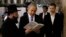 FILE - Israel's Prime Minister Benjamin Netanyahu, center, reads a prayer with Western Wall Rabbi Shmuel Rabinowitz, left, as his son Yair, right, stands next to him, at the Western Wall, in Jerusalem's Old City, March 18, 2015.
