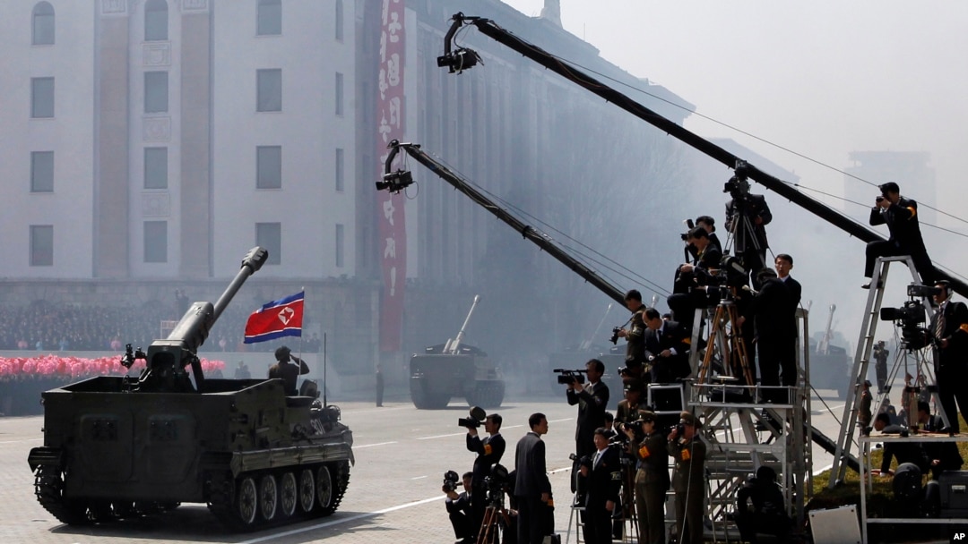 FILE - North Korean artillery pass by North Korean journalists during a military parade in Kim Il Sung Square in Pyongyang, April 15, 2012.