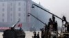 FILE - North Korean artillery pass by North Korean journalists during a parade in Kim Il Sung Square in Pyongyang, April 15, 2012.