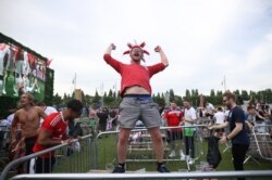 Fans celebrate after a Euro 2020 soccer match, in Manchester, Britain, June 29, 2021.