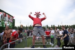 Fans celebrate after a Euro 2020 soccer match, in Manchester, Britain, June 29, 2021.