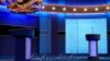 Clear protective panels stand on stage between lecterns for President Donald Trump and Democratic presidential candidate, former Vice President Joe Biden, ahead of their debate at Belmont University, in Nashville, Tennessee, Oct. 21, 2020.
