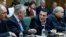 Greece's Prime Minister Alexis Tsipras, second right, and Deputy Prime Minister Giannis Dragasakis, second left, chat during the first cabinet meeting of the new government at the Parliament in Athens, on Wednesday, Jan. 28, 2015.