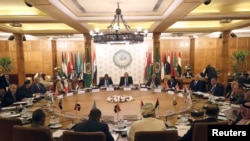 Permanent representatives of the Arab League take part in an emergency meeting to discuss Turkey's plans to send military troops to Libya, at the League's headquarters in Cairo, Egypt, Dec. 31, 2019. 
