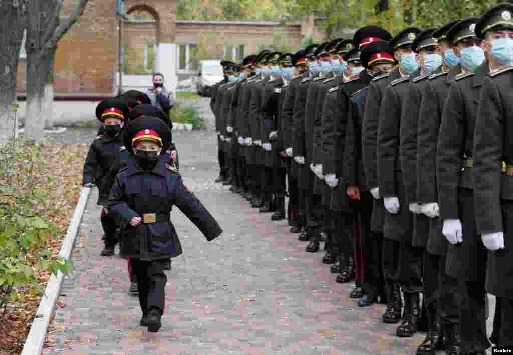 Young military march for a ceremony of receiving their shoulder marks in Kyiv, Ukraine.