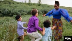 Comfort Dondo with her children. (Photo by Rebecca Parks)