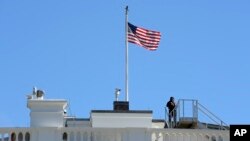 FILE - The U.S. flag flies over the White House in Washington, Nov. 10, 2016.