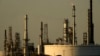 A motorist drives past the CHS oil refinery Sept. 28, 2024, in McPherson, Kan.