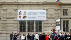 Relatives and friends gather in Paris, Sept. 16, 2013, to remember the French hostages that were kidnapped in Niger three years earlier.