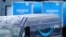 FILE - An Amazon Prime logo appears on the side of a delivery van as it departs an Amazon Warehouse location, Oct. 1, 2020, in Dedham, Massachusetts. 