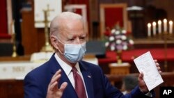 Democratic presidential candidate, former Vice President Joe Biden holds his notes as he speaks to members of the clergy and community leaders at Bethel AME Church in Wilmington, Del., June 1, 2020. 