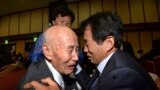 North Korean Chae Hun Sik, 88, left, meets with his South Korean son Chae Hee-yang, 65, during the Separated Family Reunion Meeting at Diamond Mountain resort in North Korea. Hundreds of elderly Koreans from divided North and South began three days of reunions with loved ones many have had no contact with since the war between the countries more than 60 years ago.
