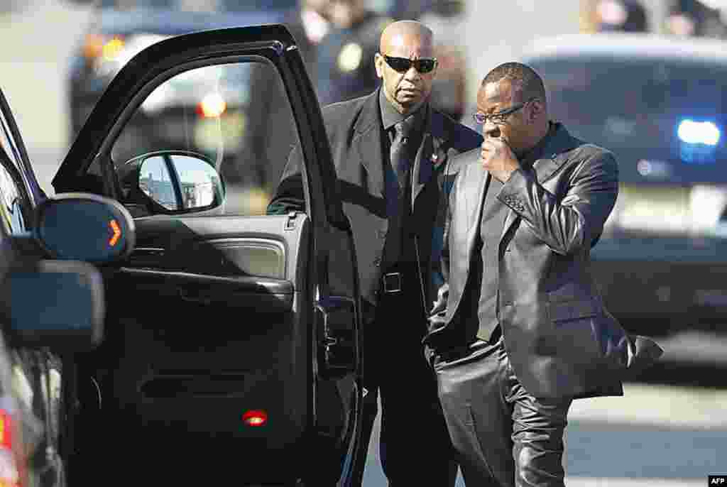 Bobby Brown (R) is denied entrance to the funeral service of his ex-wife pop singer Whitney Houston at the New Hope Baptist Church in Newark, New Jersey February 18, 2012. (REUTERS)