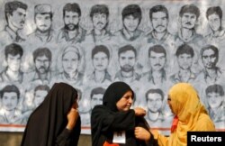 FILE - Relatives of missing Kashmiri men attend a sit-in protest in a park organized by the Association of Parents of Disappeared Persons (APDP) in Srinagar, Oct. 10, 2013.
