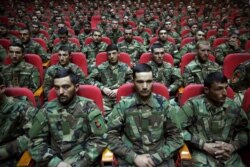 Afghan National Army soldiers attend their graduation ceremony after a three-month training program at the Afghan Military Academy in Kabul, Afghanistan, Sunday, Jan. 5, 2020.
