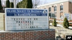 FILE - A sign outside the Islamic Society of Baltimore's Al-Rahmah School.