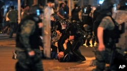 Police arrest protesters after clashes during a protest in Skopje, Macedonia, May 5, 2015. 