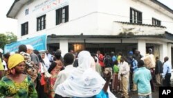 Outside the election board in North Kivu capital, Goma, crowds wait for hours for replacement cards, November 25, 2011.