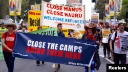 Refugee advocates protest in Sydney, Oct. 15, 2017, against the treatment of asylum-seekers in detention centers in Nauru and on Manus Island.