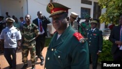 FILE - Guinea-Bissau armed forces chief-of-staff General Antonio Indjai (C) leaves a meeting with the president and the regional body of the Economic Community of West African States (ECOWAS) in the capital Bissau, Nov. 7, 2012. 