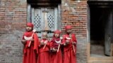 A group of Nepalese Buddhist boys are seen before they attend Bratabandha, a coming-of-age ceremony, in Kathmandu.