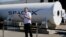 FILE - Telsa CEO Elon Musk congratulates the winners of the Hyperloop Pod Competition II at SpaceX's Hyperloop track in Hawthorne, Calif., Sunday, Aug. 27, 2017.