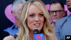 FILE - Stormy Daniels speaks during a ceremony for her in West Hollywood, Calif., May 23, 2018. 