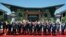 Leaders attending the Belt and Road Forum wave as they pose for a group photo at the Yanqi Lake venue on the outskirt of Beijing, China, May 15, 2017. 