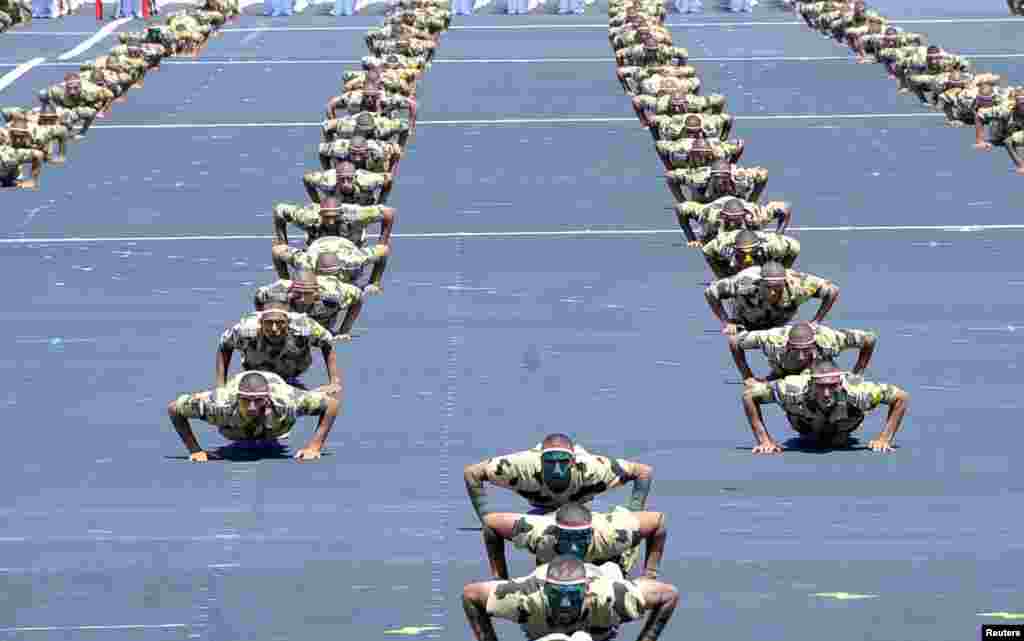 Military students display their skills to mark the opening of the Mohamed Najib military base, the graduation of new graduates from military colleges, and the celebration of the 65th anniversary of the July 23 revolution at El Hammam City in the North Coast, in Marsa Matrouh, Egypt, July 22, 2017.