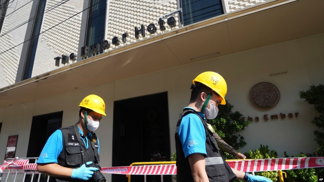 Police forensics team arrive at a hotel in Bangkok, Thailand, Dec. 30, 2024, a day after a fire killed three people. 