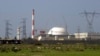 FILE - The reactor building of Iran's nuclear power plant and electricity poles are seen, at Bushehr, Iran, Feb. 27, 2005. 