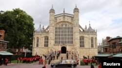 FILE: The coffin of Britain's Queen Elizabeth arrives outside St George's Chapel at Windsor Castle where she was laid to rest in the crypt, in Windsor, Britain. Taken 9.19.2022