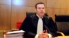 Criminal court President Nicolas Leger chairs the Rennes courtroom, western France, Monday, March 16, 2015.