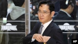 FILE - Lee Jae-yong, a vice chairman of Samsung Electronics Co., arrives for a hearing at the National Assembly in Seoul, South Korea, Tuesday, Dec, 6, 2016. 