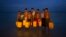 Newly arrived Rohingya Muslims carry the yellow plastic drums they used as flotation aids and listen to Bangladeshi authorities, not pictured, after swimming across the Naf River at Shah Porir Dwip, Bangladesh, Nov. 5, 2017.