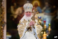 FILE - In this photo by the Russian Orthodox Church Press Service, Russian Orthodox Patriarch Kirill delivers the Christmas service in the Christ the Savior Cathedral in Moscow, on January 7, 2024.