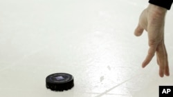 FILE - An 11-year-old Canadian boy whose identity has not been disclosed died on Dec. 15, 2023, three days after being struck in the neck by a hockey puck. in Saint Eustache, Quebec.
