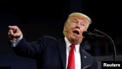 FILE - U.S. President Donald Trump speaks during a "Make America Great Again" rally in Evansville, Indiana, Aug. 30, 2018.