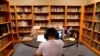 FILE - A Los Angeles Unified School District student attends an online class at Boys & Girls Club of Hollywood in Los Angeles, Aug. 26, 2020.