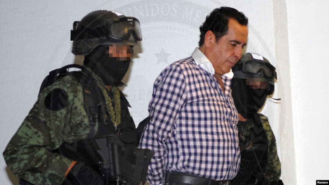 FILE - Soldiers escort head of the Beltran Leyva drug cartel Hector Beltran Leyva in Mexico City, in this handout picture taken Oct. 1, 2014 by the Attorney General's Office. 
