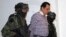 FILE - Soldiers escort head of the Beltran Leyva drug cartel Hector Beltran Leyva in Mexico City, in this handout picture taken Oct. 1, 2014 by the Attorney General's Office. 