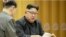 FILE - This image made from undated video of a news bulletin aired by North Korea's KRT on Sept. 3, 2017, North Korea's leader Kim Jong Un holds the Presidium of the Political Bureau of the Central Committee. 