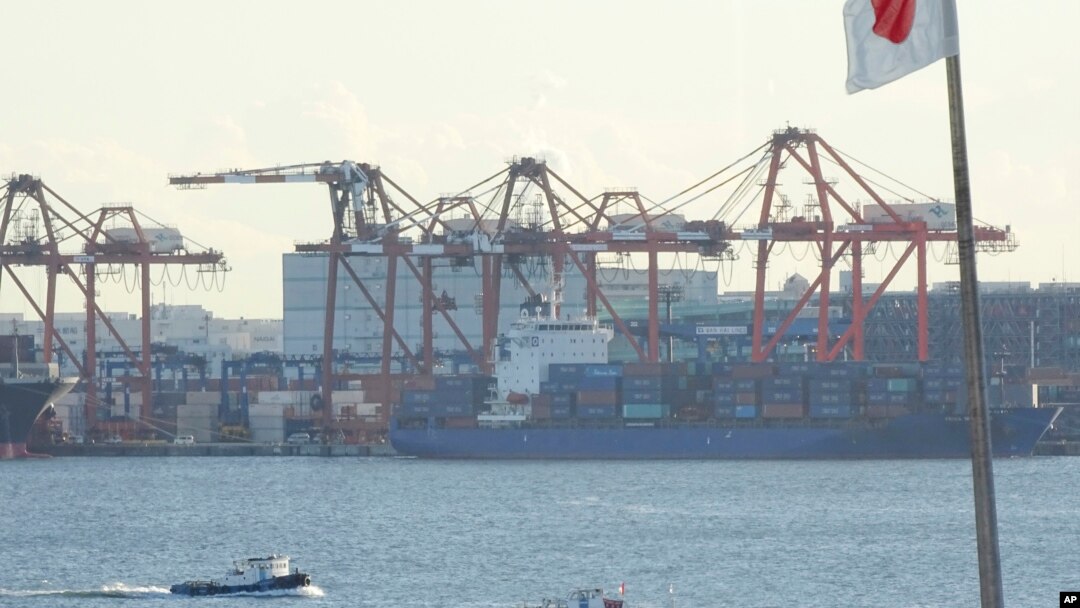 FILE - A tug boat goes by the pier of a container terminal in Tokyo, Jan. 25, 2017. Talk of a possible 20 percent tax on U.S. imports from Mexico is raising eyebrows in Asia, where exports to the U.S. drive growth in many economies. 