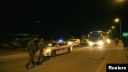 A general view of the transport convoy, during the Syria Civil Defence, also known as the White Helmets, extraction from the Golan Heights, Israel in this still image taken from video, provided by the Israeli Army, July 22, 2018.