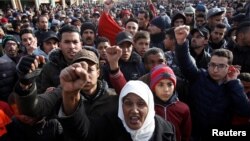 People shout slogans during a protest after the death of a miner who died while working in a clandestine coal mine in Jerada, Morocco, Feb. 3, 2018.