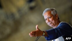 (FILES) Bangladeshi Nobel Peace Prize winner and microcredit pioneer Muhammad Yunus gestures as he delivers a lecture entitled "Social businness: sustainable solutions to the most pressing social challenges " at Italy's Chamber of Deputies on July 10, 201