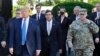 FILE - In this June 1, 2020 file photo, President Donald Trump departs the White House to visit outside St. John's Church, in Washington. Walking behind Trump, Secretary of Defense Mark Esper and Gen. Mark Milley, chairman of the Joint Chiefs of Staff. 
