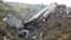 Rescue workers walk among the crash site of a cargo airplane near the airport at Brazzaville in the Republic of Congo on Dec. 1, 2012.
