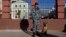 Russian police officer stands on a street in Sochi on December 30, 2013. 